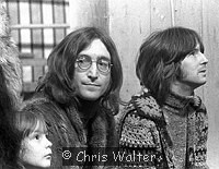 Photo of John Lennon 1968 with Julian Lennon and Eric Clapton at the Rolling Stones Rock & Roll Circus.