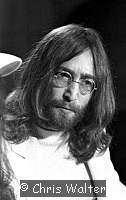 Photo of Beatles 1969 John Lennon  at Heathrow Airport.