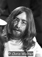 Photo of Beatles 1969 John Lennon  at Heathrow Airport.