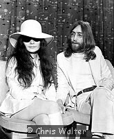 Photo of Beatles 1969 John Lennon and Yoko Ono at Heathrow Airport.