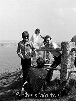 Photo of Beatles 1967 George Harrison and John Lennon with Neil Aspinall film Magical Mystery Tour at Newquay 